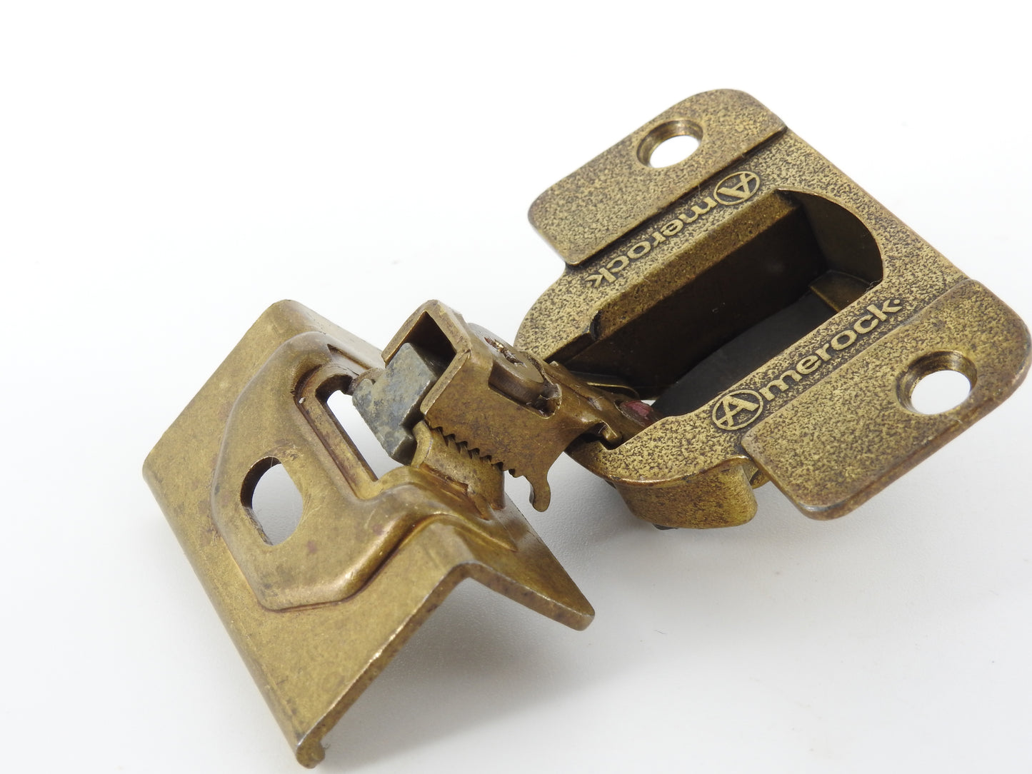 Amerock 2010 hinge in the Burnished Brass finish.  1 1/4" overlay.  45mm drilling boring pattern