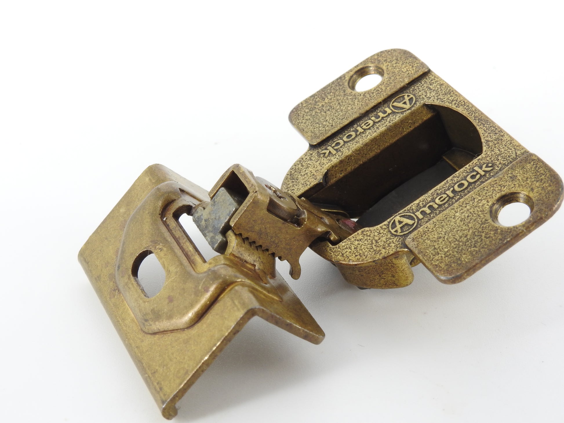 Amerock 2010 hinge in the Burnished Brass finish.  1 1/4" overlay.  45mm drilling boring pattern